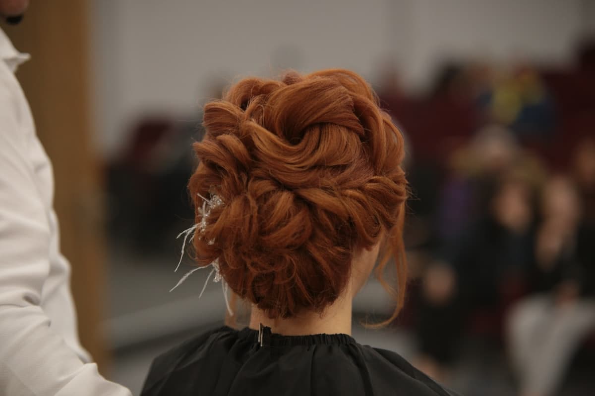 Hair styling in progress ahead of the finished look