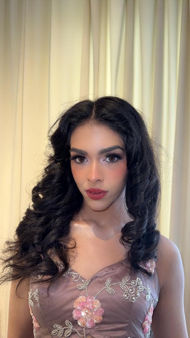 Party glam with bold red lips and voluminous curls