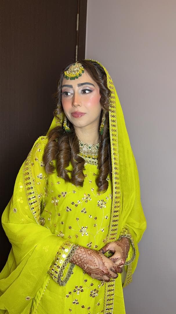 Bridal profile portrait in a neon lime outfit with gold jewellery