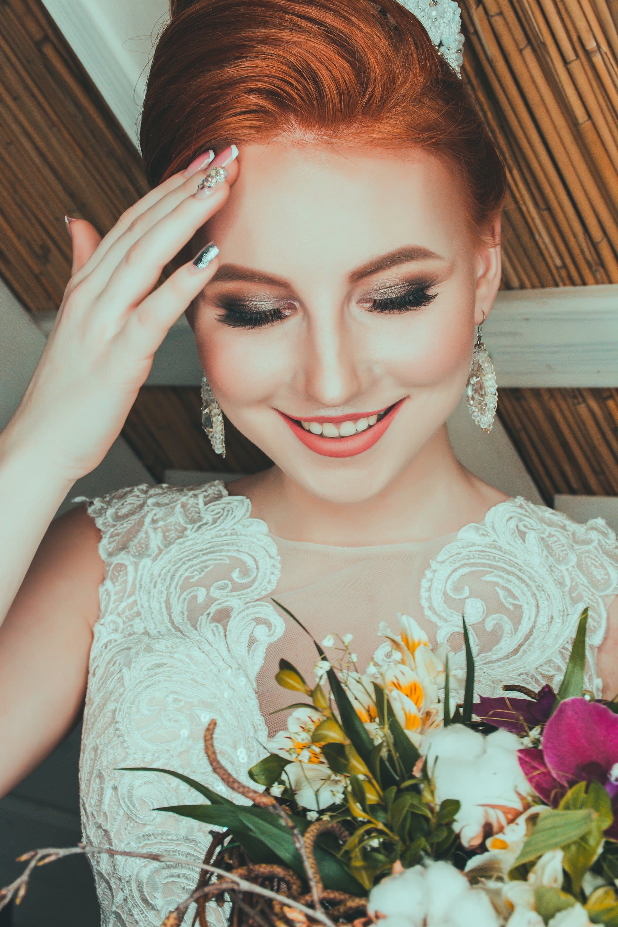 Bride in a soft veil with a natural, radiant bridal makeup finish